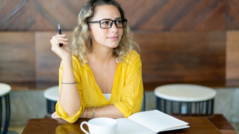 The Easiest Way to Become a Successful Writer and Authors. 2 tisankan pretty-curly-young-woman-writing-notes-startup-project